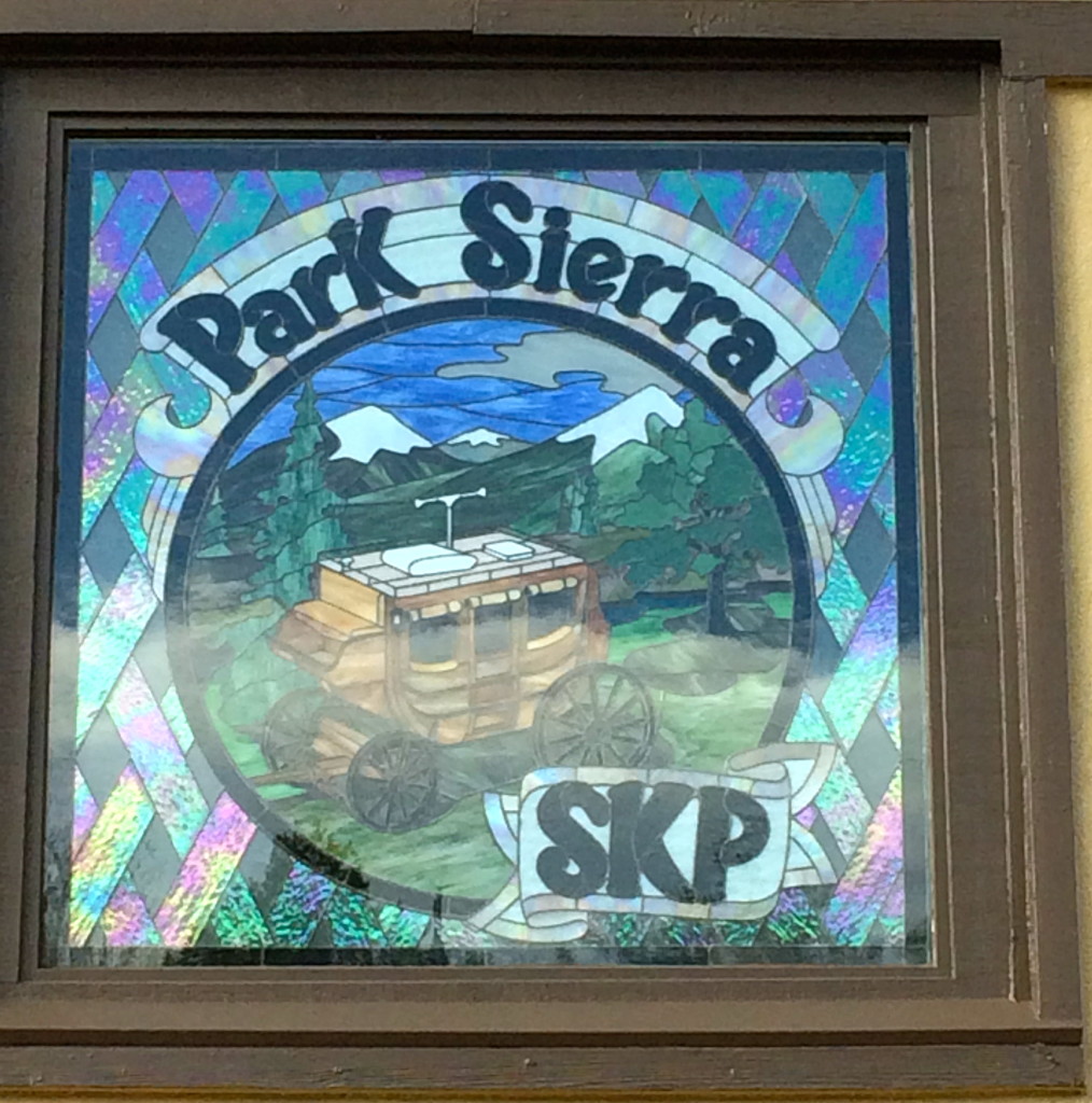 Stained glass sign on the clubhouse
